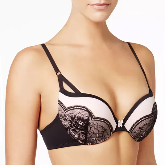 A lace-trimmed push-up bra with black detailing, featuring a small bow at the center and adjustable straps.