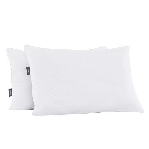 Two white pillows with a subtle pattern and small brand tags on the side.