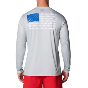 A person is wearing a light gray long-sleeve shirt with a blue star pattern resembling the American flag and fish silhouettes on the back, paired with red shorts.