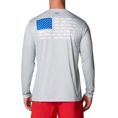 A person is wearing a light gray long-sleeve shirt with a blue star pattern resembling the American flag and fish silhouettes on the back, paired with red shorts.