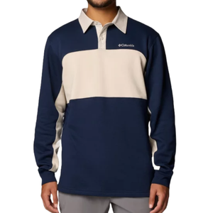 A long-sleeve, color-blocked rugby shirt with a collar, featuring navy blue and beige panels, and the Columbia logo on the chest.