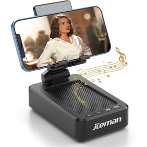 A phone holder with a built-in speaker is shown, featuring musical notes indicating sound output. The phone is held securely in a horizontal position above the speaker, with a figure visible on the screen.