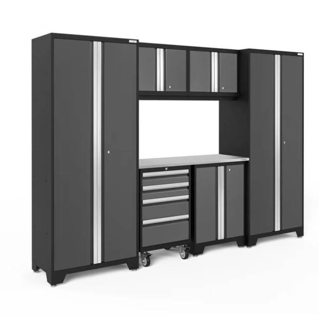A modular garage storage system featuring tall cabinets, upper storage units, a central workbench, drawers with wheels, and additional side cabinets.