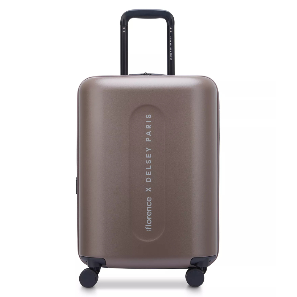 A brown hard-shell suitcase labeled \“florence X DELSEY PARIS,\“ featuring a retractable handle and four spinner wheels for easy mobility.