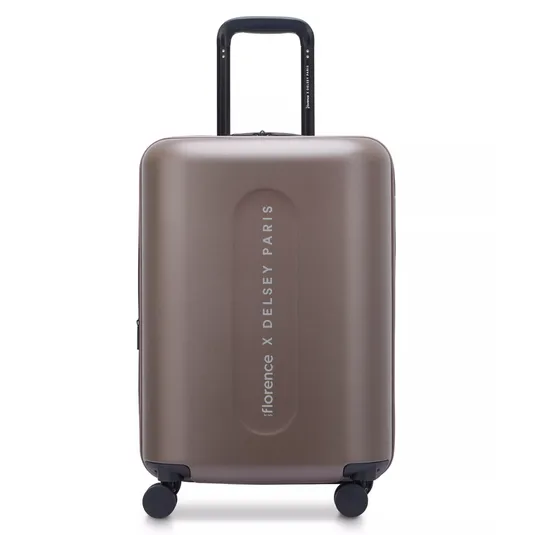 A brown hard-shell suitcase labeled \“florence X DELSEY PARIS,\“ featuring a retractable handle and four spinner wheels for easy mobility.