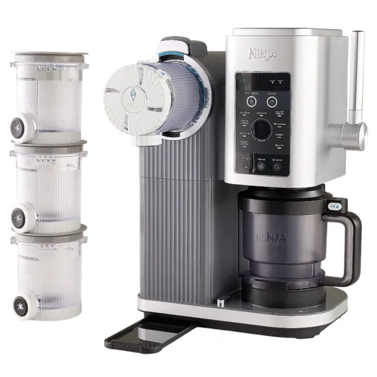 Ninja Thirsti Drink System with three specialty pods, featuring a sleek design and a user-friendly control panel, designed for customizable beverage creation.