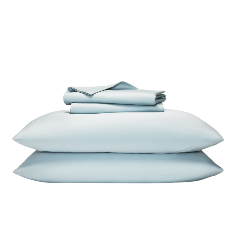 A neatly folded set of light blue bed sheets, including two pillowcases and a fitted sheet, is stacked on a white background.