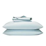 A neatly folded set of light blue bed sheets, including two pillowcases and a fitted sheet, is stacked on a white background.