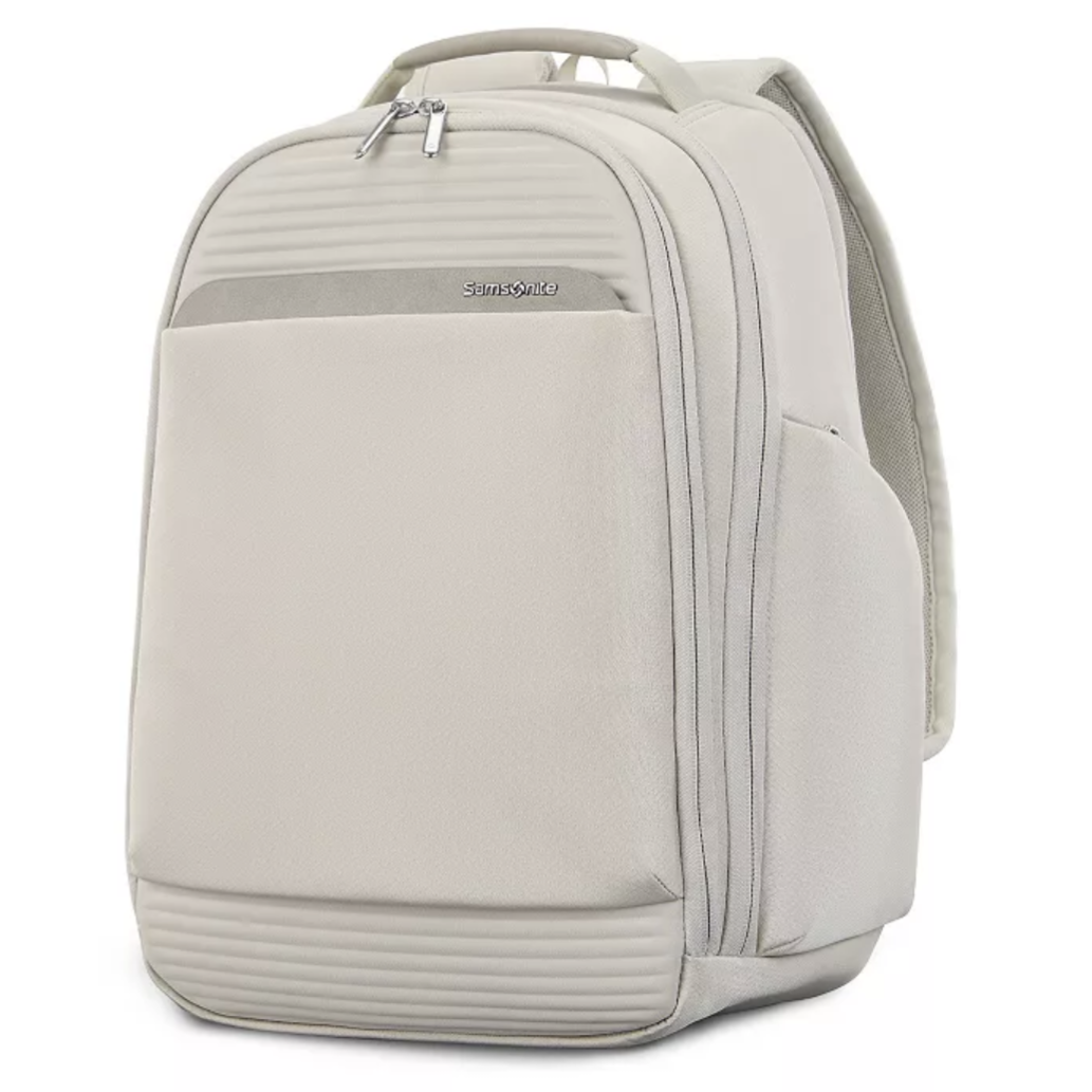 A light beige Samsonite backpack with multiple zippered compartments and a front pocket, featuring a sleek design and padded back straps.