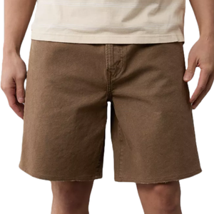 Brown knee-length shorts worn by a person, featuring a basic design with visible stitching and a straight hem.