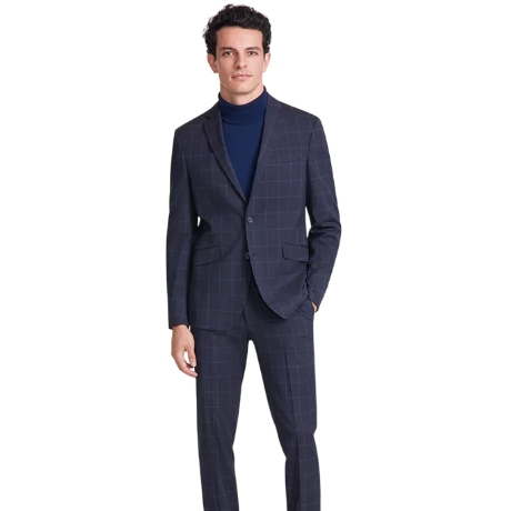 A man is wearing a Kenneth Cole Techni-Cole slim suit with a navy grid pattern. The outfit includes a tailored jacket and matching pants, paired with a dark blue turtleneck.
