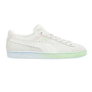 Puma Suede Classic sneaker in white with light green gradient sole and Puma branding.