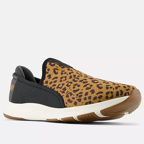 A slip-on shoe with leopard print design and a brown sole.