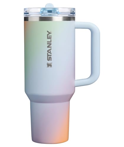 A Stanley insulated tumbler with a handle and a lid, featuring a gradient color design.