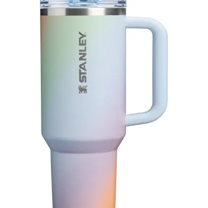A Stanley insulated tumbler with a handle and a lid, featuring a gradient color design.