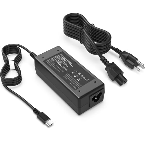 A black power adapter with a USB-C connector, featuring a power supply unit with technical specifications displayed, accompanied by a detachable AC power cord with a standard plug.