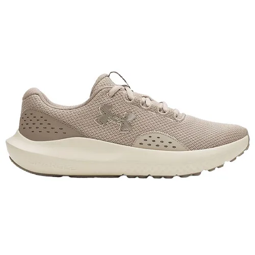 A beige athletic sneaker with breathable mesh upper, cushioned sole, and the Under Armour logo on the side.