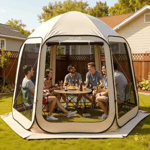 A group of people is seated inside a VEVOR pop-up gazebo tent enjoying drinks and snacks, set up in a backyard.