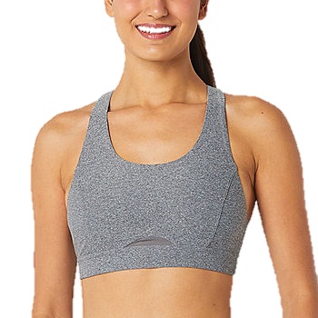 A woman wearing a gray sports bra with a racerback design and minimal stitching, suitable for athletic activities.
