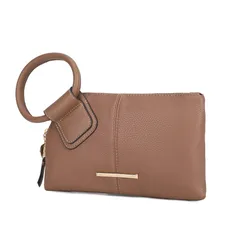 A tan wristlet clutch with a circular handle and gold-tone metal branding plaque.
