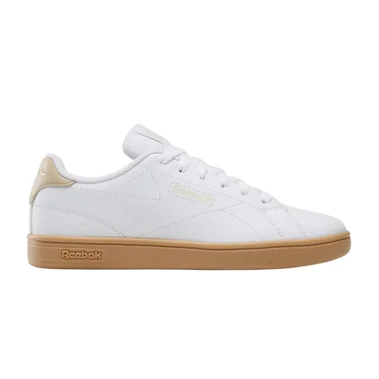 A white Reebok sneaker with beige accents and a gum sole, featuring a low-top design and lace-up closure.