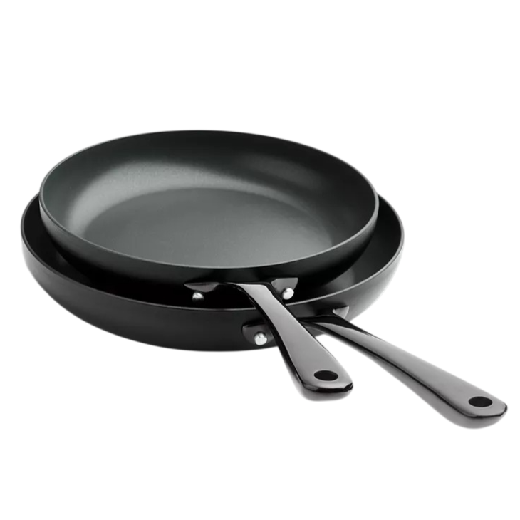 Two black non-stick frying pans with matching handles, stacked together.