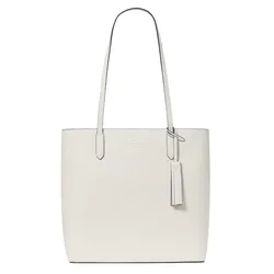 A white leather tote bag with long handles, featuring a tassel accent and subtle branding near the top.