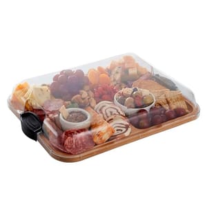A transparent, rectangular container with compartments filled with various foods such as cheese, meats, fruits, nuts, and crackers, with a black handle on one end.