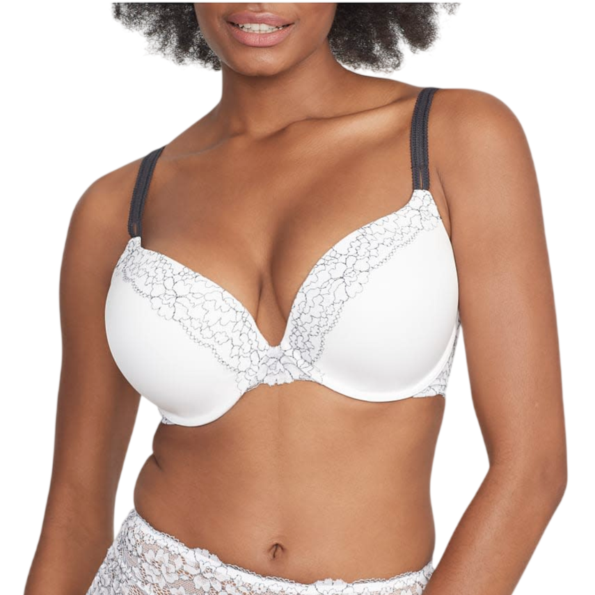 A woman wears a white and black bra with lace detailing and matching white lace high-waisted panties featuring a floral pattern.