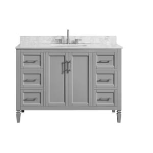 Gray bathroom vanity with marble countertop and built-in sink. Features multiple drawers and cabinet doors with silver handles.