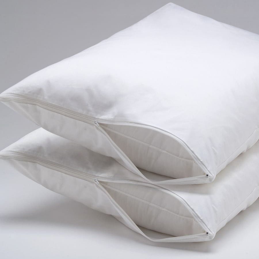 Two white pillow protectors with zippers, stacked one on top of the other.