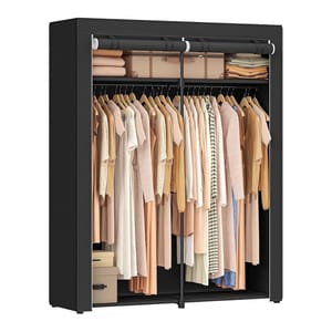 A black portable closet with two sections features a top shelf for folded items and storage boxes, while the main area contains two rows of hangers holding a variety of beige and earth-toned clothing.