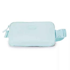 A light blue, rectangular belt bag with a zippered main compartment and an adjustable strap. The bag includes a small logo on the front.