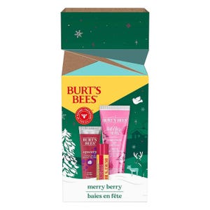 The Burt's Bees Merry Berry Gift Set includes a tube of lip balm and a tube of hand cream, both packaged in a festive holiday-themed box with berry accents.