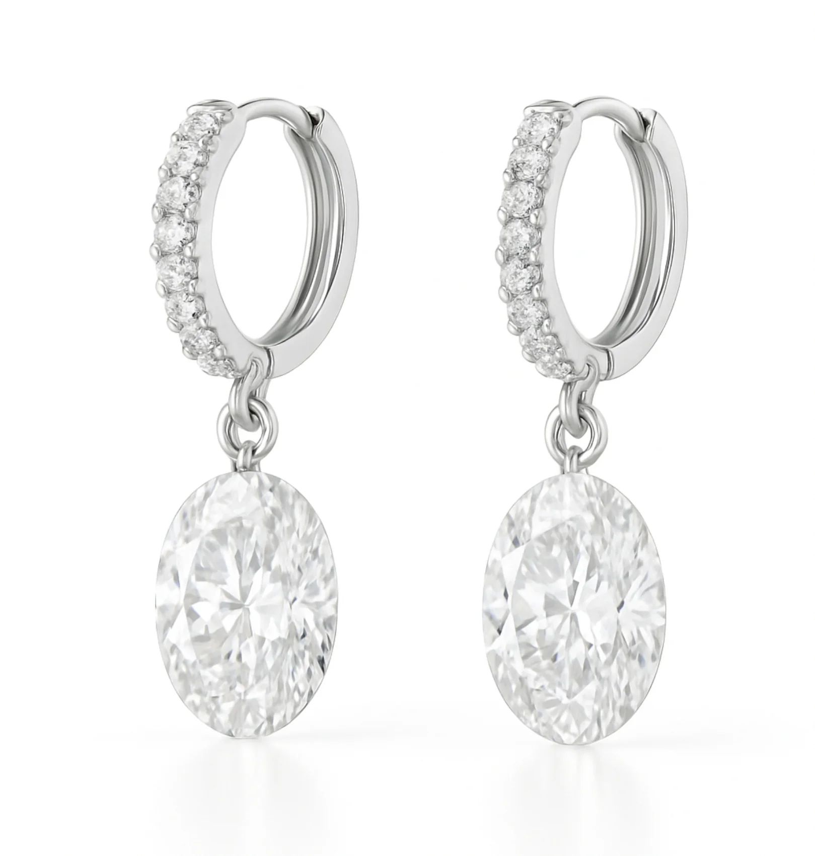 Elegant silver hoop earrings adorned with small diamonds, featuring large oval-cut diamond pendants.