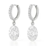 Elegant silver hoop earrings adorned with small diamonds, featuring large oval-cut diamond pendants.