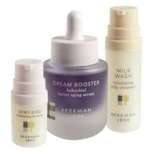 Three skincare items: \“Dream Booster\“ bakuchiol serum, \“Dewy Eyed\“ illuminating eye serum, and \“Milk Wash\“ exfoliating jelly cleanser, all from Beekman 1802.