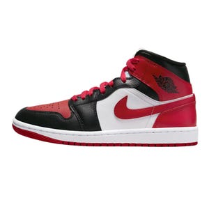 Women's Air Jordan 1 Mid Shoes feature a black, white, and red leather upper with a red Nike Swoosh and laces. The design includes a classic Air Jordan Wings logo on the ankle, with a white midsole and red outsole.