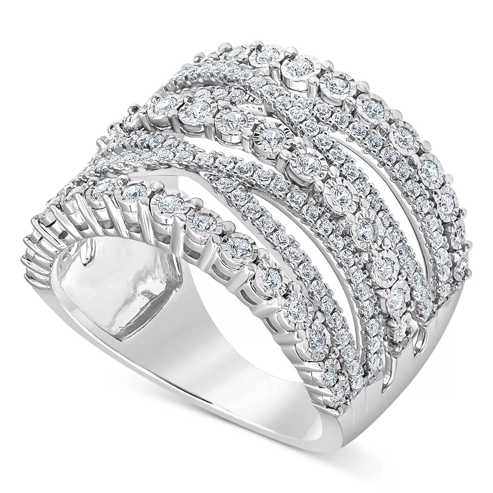 A silver ring with multiple rows of round-cut diamonds in an overlapping pattern, creating a wide, sparkling band design.