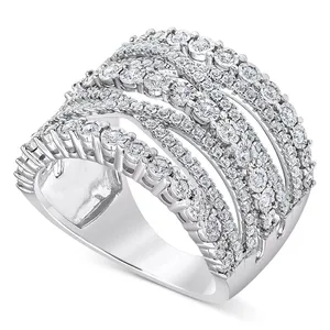 A silver ring with multiple rows of round-cut diamonds in an overlapping pattern, creating a wide, sparkling band design.