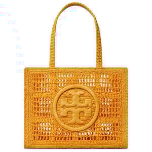 A woven yellow tote bag featuring a geometric pattern and central circular emblem.