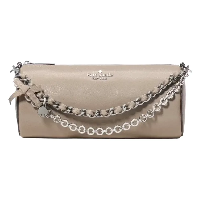 A beige Kate Spade New York clutch bag featuring a chain handle with a ribbon and charm detail.