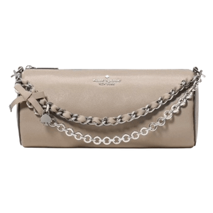 A beige Kate Spade New York clutch bag featuring a chain handle with a ribbon and charm detail.