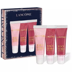 Lancôme Juicy Tubes Original lip gloss set contains three shades in sparkly and natural tones. The packaging displays the brand name and showcases the gloss tubes.