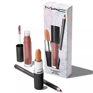 MAC Lip Trio featuring a lipstick, lip gloss, and lip liner in coordinating shades. Packaging is designed with floral patterns and labeled \“Blossom Shift\“.