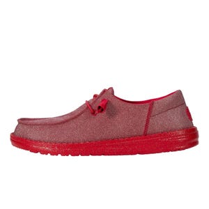 Hey Dude Wendy Funk Mono Sparkle Shoes feature a red, glittery finish with a casual design, including a low-profile silhouette, lace-up closure, and a comfortable red sole.