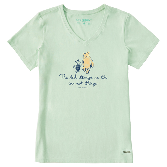 Pale green V-neck T-shirt featuring a graphic of two characters walking together and the phrase \“The best things in life are not things.\“ Marked with \“LIFE IS GOOD\“ branding.