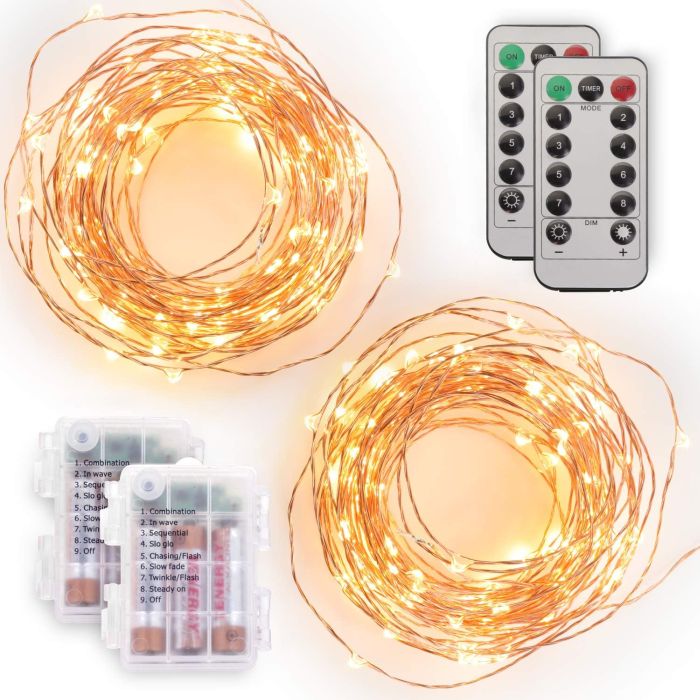 Fairy string lights with warm white LEDs, two battery boxes, and two remote controls featuring options for different lighting modes and brightness settings.