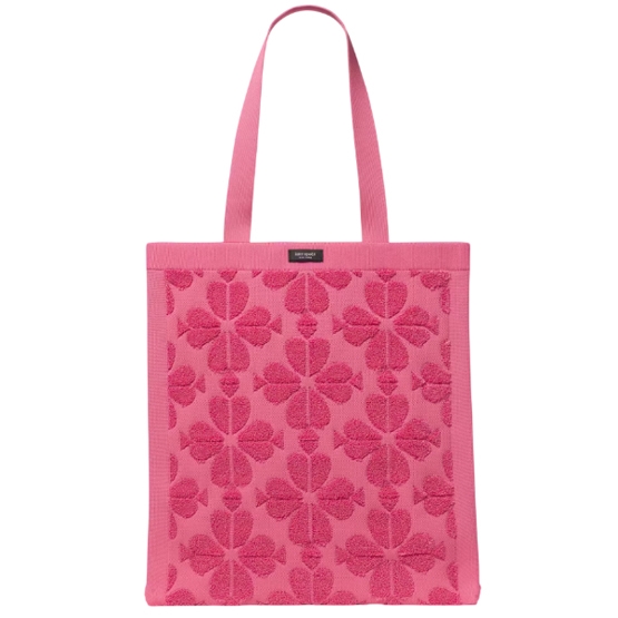 A pink tote bag featuring a textured pattern of floral designs with matching pink straps.