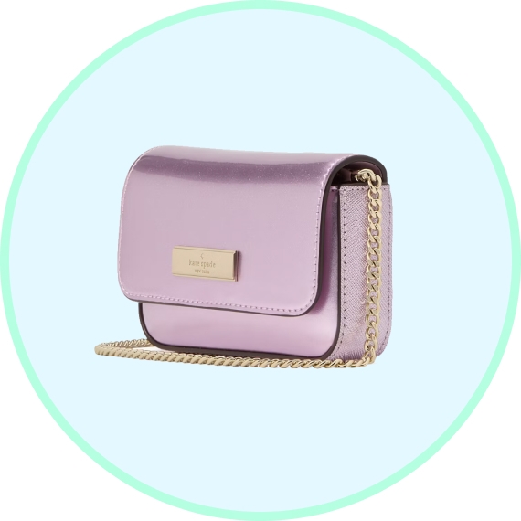 A lavender Kate Spade crossbody bag with a gold chain strap.